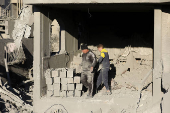 Site of an Israeli strike on a house, amid the Israel-Hamas conflict, in Al Maghazi refugee camp in the central Gaza Strip