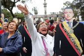 Supporters of Ecuador's President Daniel Noboa react as they listen to his speach in front of the Government Palace in Quito