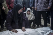 Palestinians mourn their dead at Deir Al Balah hospital after Israeli airstrike in central Gaza