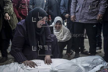 Palestinians mourn their dead at Deir Al Balah hospital after Israeli airstrike in central Gaza