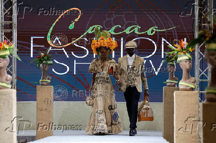 Models present clothing made from used cocoa sacks during the ninth edition of the National Cocoa and Chocolate Days in Abidjan