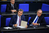 Bavarian State Prime Minister Markus Soeder of the Christian Social Union (CSU) looks on, at the lower house of parliament, the Bundestag, in Berlin