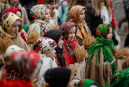 Children dressed in traditional Ukrainian costumes attend a Christmas celebration in Lviv