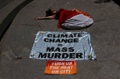 A climate control activists demonstrates outside the global headquarters of Citigroup in New York City