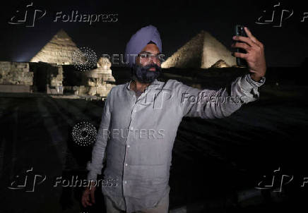 Giza Pyramids are lit up for World Tourism Day on the outskirts of Cairo