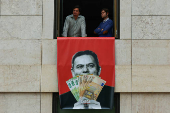 Far-right political party Chega expose banners on the facade of the Portuguese parliament against the wage reinstatement for politicians after the cuts imposed by the Troika, during the debate and vote of the 2025 budget bill on final reading, in Lisbon