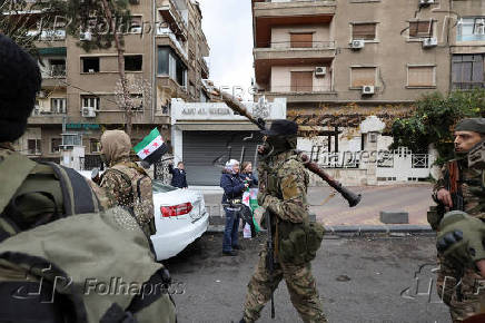 Khaled Brigade, a part of Hay'at Tahrir al-Sham (HTS), hold a military parade, in Damascus