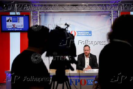 Far-right Freedom Party's co-Secretary-General Christian Hafenecker speaks to reporters