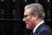 British Prime Minister Keir Starmer walks outside 10 Downing Street in London