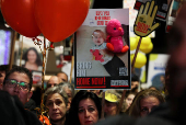 People gather to mark the second birthday of the youngest hostage in Gaza, Kfir Bibas, in Tel Aviv