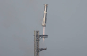 The Super Heavy booster returns to its launch pad after the SpaceX Starship continued to space after it was launched on its eighth test at the company's Boca Chica launch pad in Brownsville