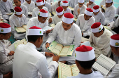 Koranic students read the Koran in Kuala Lumpur