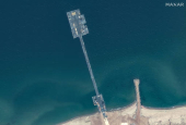 A satellite view shows a floating pier, on the Gaza shoreline