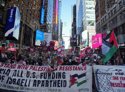 People walk in demonstration, nearly one year after Hamas' October 7, 2023 attack in southern Israel, in New York City