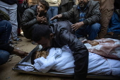 Palestinians mourn their dead following Israeli airstrike on Al-Mawasi