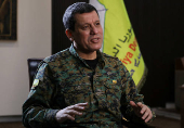 FILE PHOTO: Commander of Syrian Kurdish-led forces Mazloum Abdi attends an interview with Reuters in Hasakah