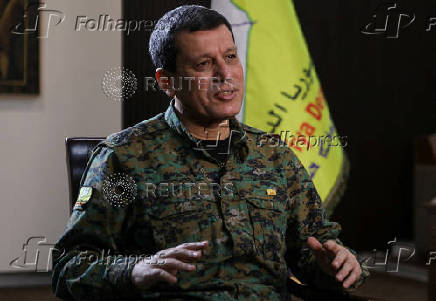 FILE PHOTO: Commander of Syrian Kurdish-led forces Mazloum Abdi attends an interview with Reuters in Hasakah