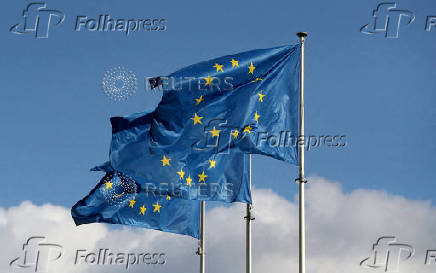 FILE PHOTO: European Union flags fly outside the EU Commission headquarters in Brussels