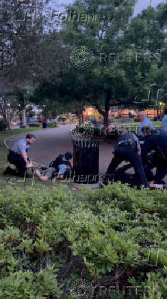 Police officers detain protesters, during pro-Palestinian protest in Jackson Square, amid the ongoing conflict between Israel and the Palestinian Islamist group Hamas, in New Orleans