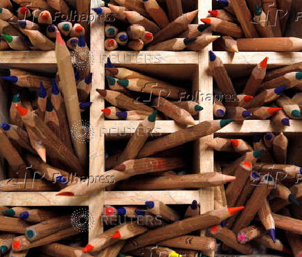 FILE PHOTO: Coloured pencils are pictured in a wooden box at a nursery school in Eichenau