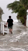 A man walks near the beach at Indian Shores