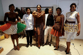 Models parade in dresses covered in chocolate and chocolate patterns during the ninth edition of the National Cocoa and Chocolate Days in Abidjan,