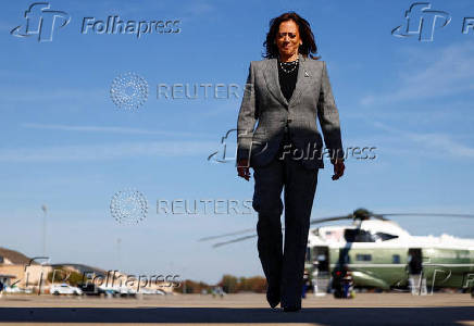 Democratic presidential nominee U.S. Vice President Kamala Harris boards Air Force Two to depart for Michigan