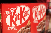 Nestle KitKat products are displayed on a shelf in a supermarket