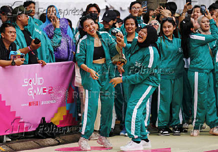 Players attend an event with the Red Light, Green Light game at Gelora Bung Karno Stadium ahead of the release of the Netflix series Squid Game: Season 2 in Jakarta