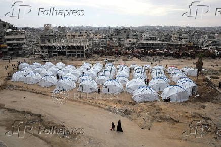 Palestinians set up a new tent camp to shelter people expected to return to northern Gaza