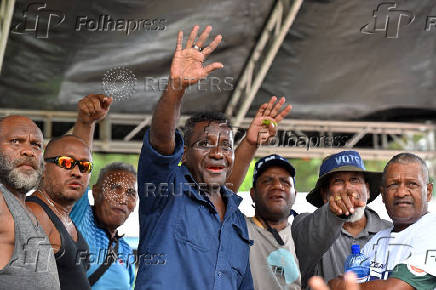 Former prime minister Gordon Darcy Lilo waves at a rally in the capital Honiara ahead of the election, Solomon Islands