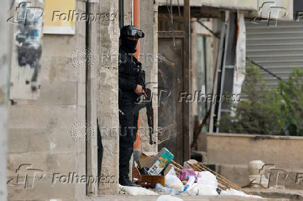 Palestinian security forces operate at the camp in Jenin