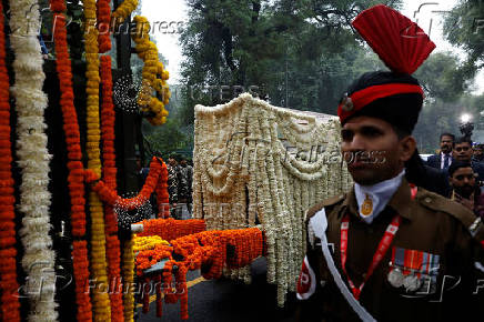 The coffin with the mortal remains of India's former PM Singh arrives for public viewing at the Congress party?s headquarters in New Delhi