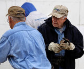 FILE PHOTO: Former U.S. President Jimmy Carter attends Habitat for Humanity home building site in Washington