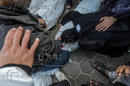 Palestinians mourn their dead at Deir Al Balah hospital after Israeli airstrike in central Gaza