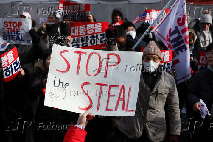 Pro-Yoon protesters participate in a rally outside a court, in Seoul