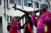 Religious leaders carry a cross during a silent Good Friday procession in Durban
