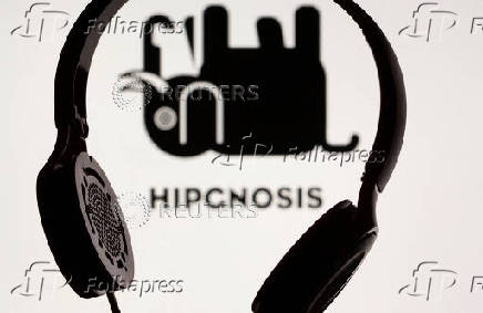 FILE PHOTO: Headset seen in front of displayed Hipgnosis logo in this illustration taken