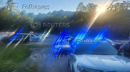 Law enforcement officers gather on the I-75 highway after reports of multiple people shot in Kentucky