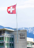 A Swiss flag flutters on the headquarters of Nestle in Vevey