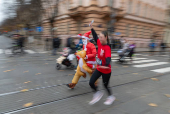 Runners wearing Santa Claus-themed outfits take part in the 