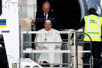 Pope Francis boards the papal plane for his apostolic visit to Corsica, at Fiumicino airport