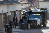 Investigators search a townhouse, in relation to the explosion in Las Vegas of a Tesla Cybertruck