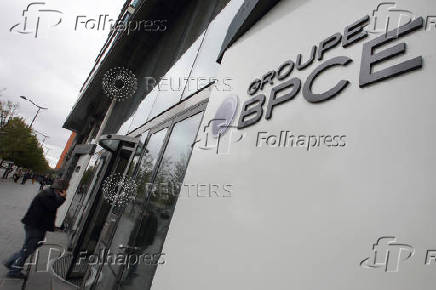 FILE PHOTO: People enter BPCE bank headquarters in Paris