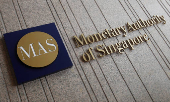 FILE PHOTO: The logo of the Monetary Authority of Singapore is pictured at its building in Singapore