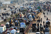 Displaced Palestinians wait to be allowed to return to their homes in northern Gaza, in the central Gaza Strip