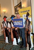 Ryanair Chief Executive O'Leary displays props and signs at press conference in Rome