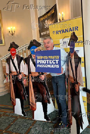 Ryanair Chief Executive O'Leary displays props and signs at press conference in Rome