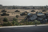 Military vehicles are seen on the road to the Rafah border amid the ongoing conflict between Israel and Hamas, in Rafah