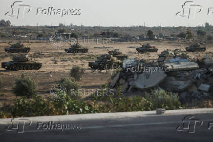 Military vehicles are seen on the road to the Rafah border amid the ongoing conflict between Israel and Hamas, in Rafah